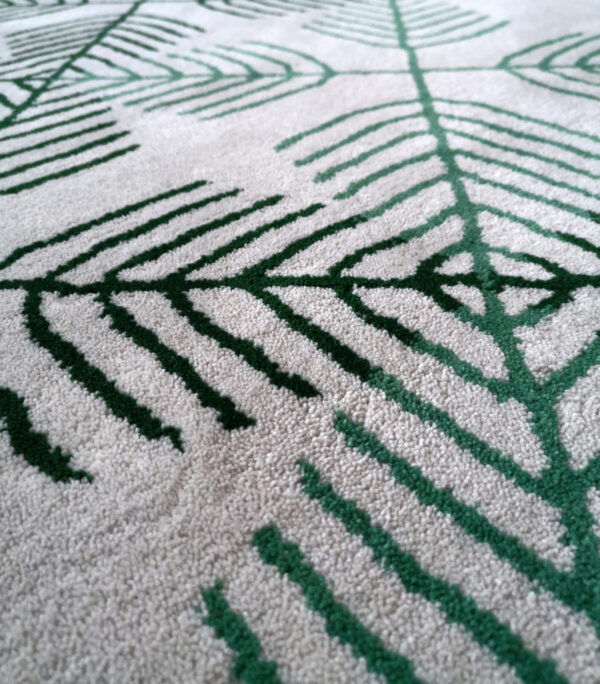 Raho wool rug in white and green with a modern geometric ornamental pattern, crafted from New Zealand wool.